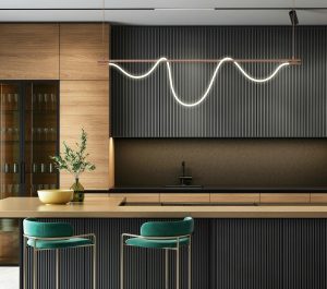 A dark ribbed bar counter with upholstered stools