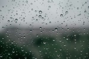 Condensation beading on a cold glass panel