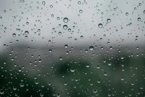 Condensation beading on a cold glass panel