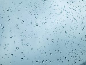 Condensation droplets against pale blue