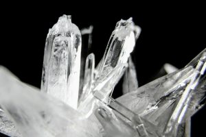 Ice crystals lit against a black background