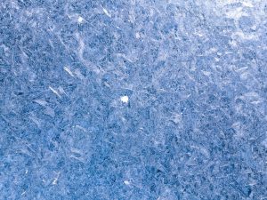 Fine frost covering a violet-blue surface