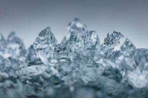 Jagged clear ice crystals lit from behind