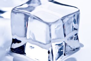 A single clear ice cube in close-up